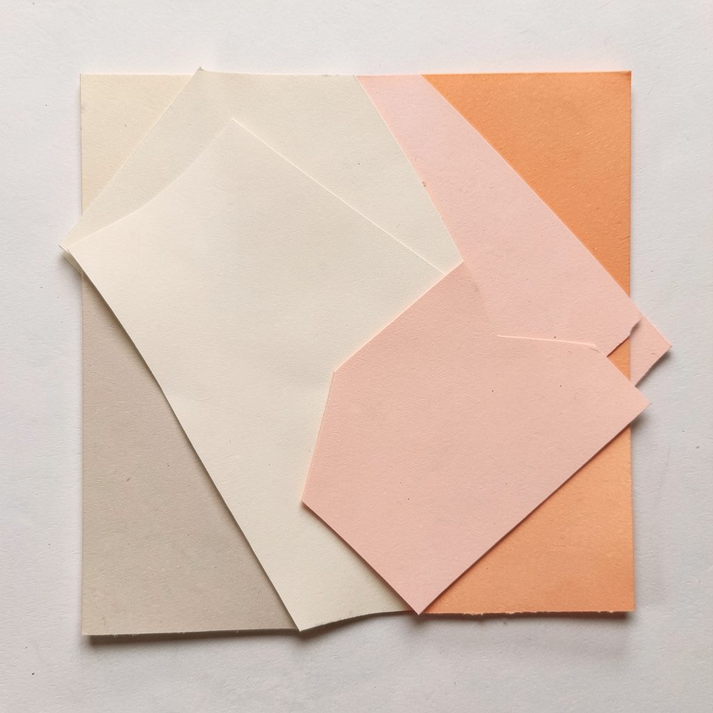 Square paper collage with soft beige layered shapes.